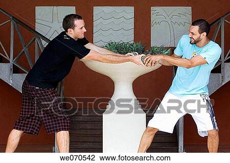 Two men fighting for pineapple View Large Photo Image Stock Image - Two men fighting for pineapple. Fotosearch