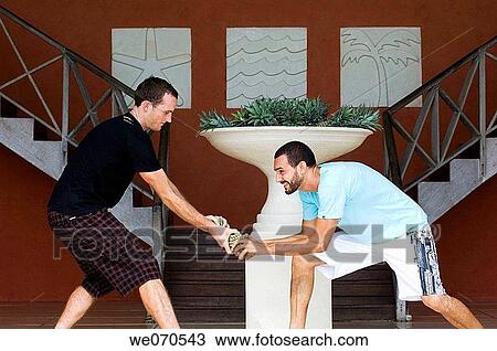 Two men fighting for pineapple View Large Photo Image Stock Image - Two men fighting for pineapple. Fotosearch