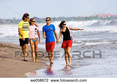 Two young couples on the beach View Large Photo Image Stock Image - Two young couples on the beach. Fotosearch