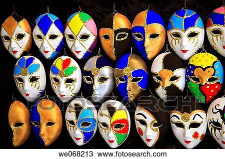 Stock Image - Venetian carnival mask display in a market near Rialto, San Polo, Venice, Veneto, Italy. Fotosearch