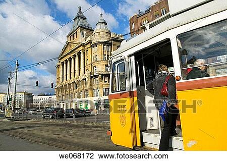 Woman climbing onboard a tramway car. Budapest. Hungary View Large Photo Image Stock Image - Woman climbing onboard a tramway car. Budapest. Hungary. Fotosearch