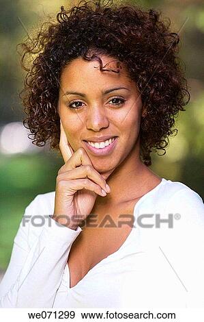 Stock Photo - woman, ethnic background: half Cuban, half German. Fotosearch