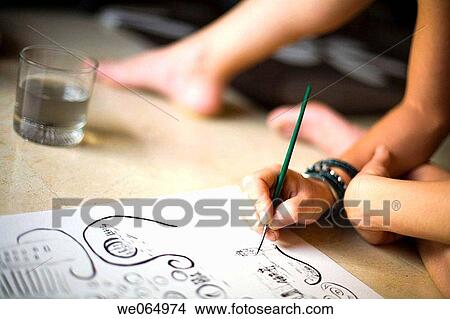 Picture - Woman painting on the floor. Fotosearch