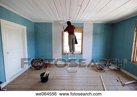 Woman repapering a room. Paperhanger, wallpaper, renovation. Sweden, Scandinavia, Europe View Large Photo Image Stock Photograph - Woman repapering a room. Paperhanger, wallpaper, renovation. Sweden, Scandinavia, Europe. Fotosearch