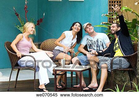 Young couples talking and relaxing View Large Photo Image Stock Photography - Young couples talking and relaxing. Fotosearch