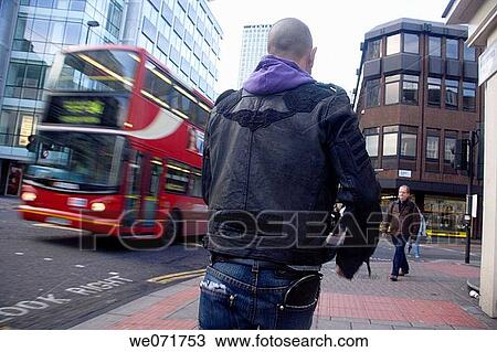 Young man walking in London, England View Large Photo Image Stock Image - Young man walking in London, England. Fotosearch