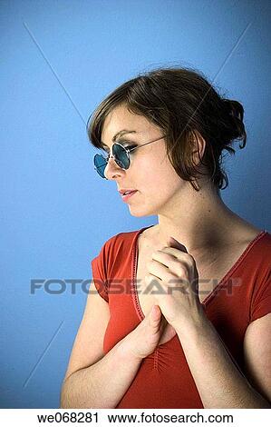 Young woman wearing sunglasses View Large Photo Image Stock Image - Young woman wearing sunglasses. Fotosearch