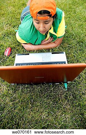 Stock Image - Young woman with Laptop.. Fotosearch