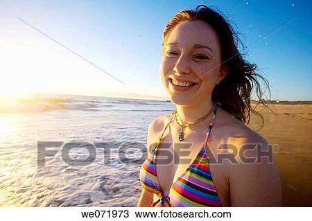 20 year old woman smiles at dusk on the Pacific ocean beach in Los Angeles, California, USA. View Large Photo Image Stock Image - 20 year old woman smiles at dusk on the Pacific ocean beach in Los Angeles, California, USA.. Fotosearch