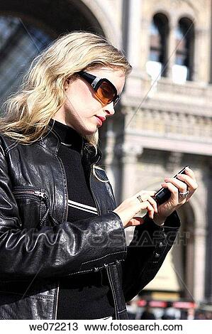 29 year old woman using cell phone View Large Photo Image Stock Image - 29 year old woman using cell phone. Fotosearch