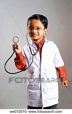 A boy dressed-up as an doctor, stethoscope in his hand View Large Photo Image Stock Image - A boy dressed-up as an doctor, stethoscope in his hand. Fotosearch