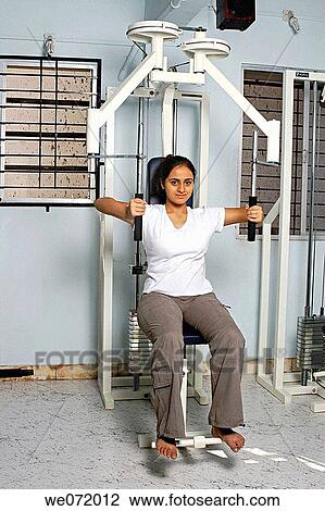 A lady in a gym. View Large Photo Image Stock Image - A lady in a gym.. Fotosearch