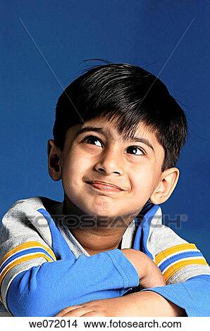 A similing kid looking away. View Large Photo Image Picture - A similing kid looking away.. Fotosearch