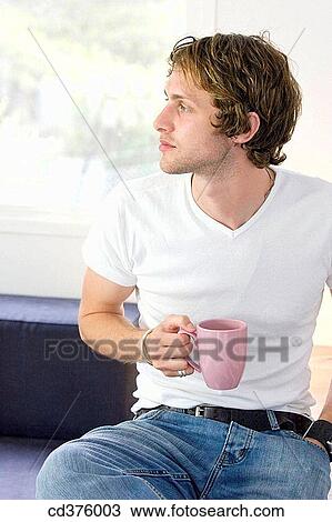 Stock Image - absorbed, calm, at-home, 20's. Fotosearch