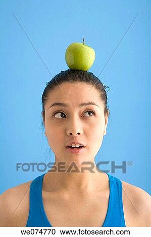 apple, balance, Asian, aim View Large Photo Image Stock Image - apple, balance, Asian, aim. Fotosearch