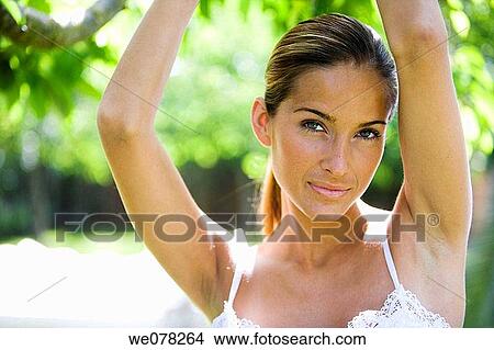 Arms raised, calm, brown hair, beauty, armpit View Large Photo Image Picture - Arms raised, calm, brown hair, beauty, armpit. Fotosearch