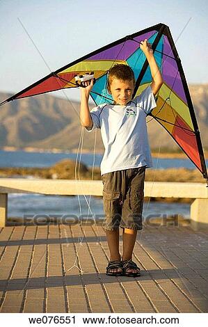 Stock Image - Arms raised, child, boy, ability. Fotosearch