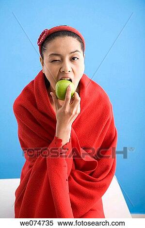 Asian, blanket, biting, bite, apple View Large Photo Image Stock Photography - Asian, blanket, biting, bite, apple. Fotosearch