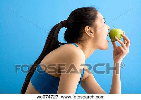 Asian, blue, biting, bite, apple View Large Photo Image Stock Photo - Asian, blue, biting, bite, apple. Fotosearch