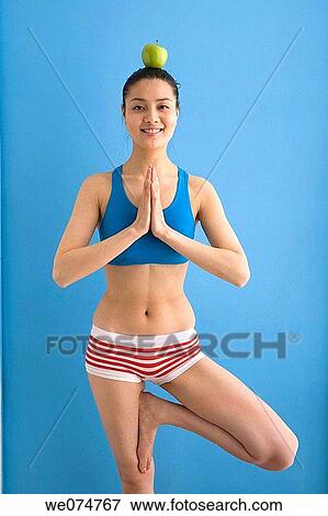 Asian, contemporary, balance, apple View Large Photo Image Stock Photo - Asian, contemporary, balance, apple. Fotosearch