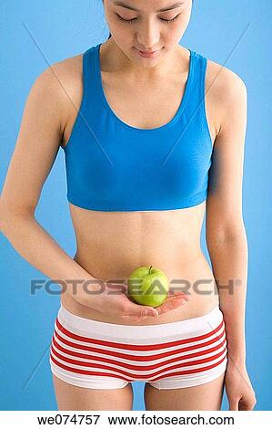 Asian, contemporary, belly, apple View Large Photo Image Stock Photo - Asian, contemporary, belly, apple. Fotosearch