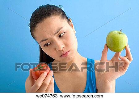 Asian, dilemma, contemporary, apple View Large Photo Image Stock Image - Asian, dilemma, contemporary, apple. Fotosearch