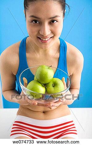 Stock Image - Asian, ethnic, bowl, apple. Fotosearch