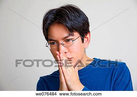 Asian man, wearing glasses, posing. View Large Photo Image Picture - Asian man, wearing glasses, posing.. Fotosearch