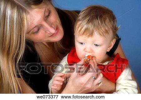 Baby boy eating first birthday cake View Large Photo Image Stock Photo - Baby boy eating first birthday cake. Fotosearch