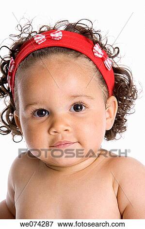 Stock Photo - baby, brunette, child, childhood, Close-up. Fotosearch