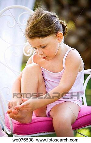 Stock Photo - baby, chair, Body care, barefoot, 3-4 years. Fotosearch