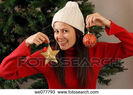 Stock Image - ball, bauble, brunette, cap, celebrate. Fotosearch