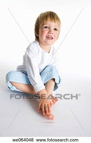 Stock Photo - barefoot, child, boy, blond, 3-4 years. Fotosearch
