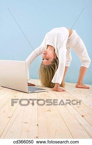 Stock Image - barefoot, computer, arch. Fotosearch