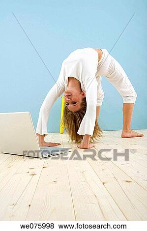 Stock Photo - barefoot, computer, arch. Fotosearch