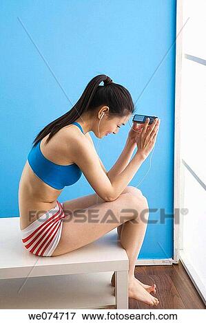 barefoot, earphone, contemporary, Asian View Large Photo Image Stock Photo - barefoot, earphone, contemporary, Asian. Fotosearch