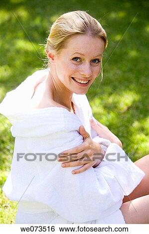 Stock Photograph - bathrobe, blond, Body care, carnality. Fotosearch