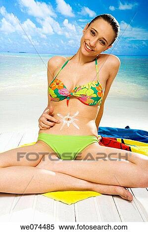 beach, belly, Body care, brunette View Large Photo Image Stock Photography - beach, belly, Body care, brunette. Fotosearch