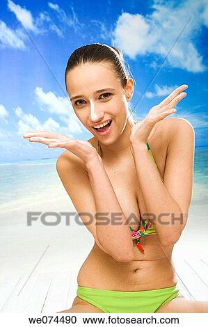 beach, Body care, brunette View Large Photo Image Stock Image - beach, Body care, brunette. Fotosearch