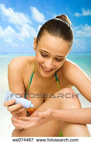 beach, Body care, brunette View Large Photo Image Stock Photo - beach, Body care, brunette. Fotosearch