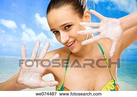Stock Photo - beach, Body care, brunette. Fotosearch