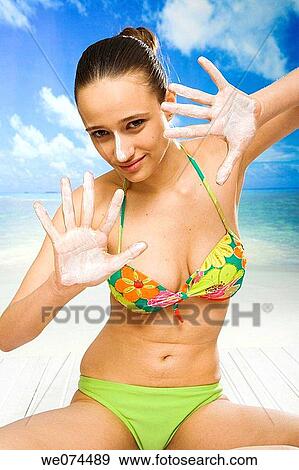 beach, Body care, brunette View Large Photo Image Stock Photo - beach, Body care, brunette. Fotosearch
