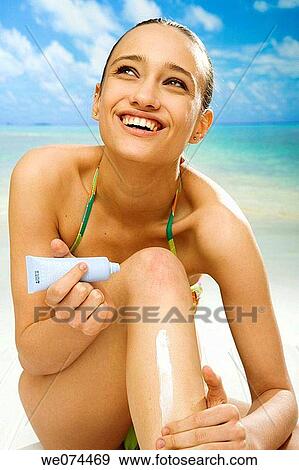 beach, brunette, Body care, apply View Large Photo Image Stock Photo - beach, brunette, Body care, apply. Fotosearch