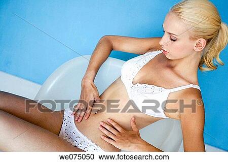 Stock Image - beauty, belly, blond, blue, Body care. Fotosearch