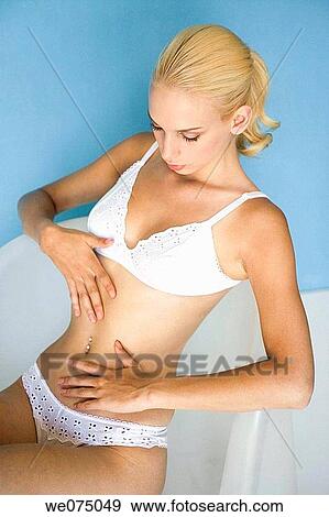 Stock Photo - beauty, belly, blond, blue, Body care. Fotosearch