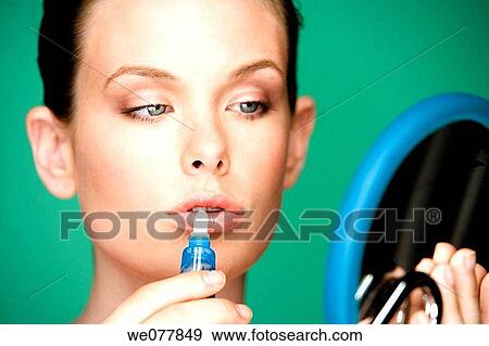 Stock Photo - beauty, blue eyes, Beauty Care, apply. Fotosearch