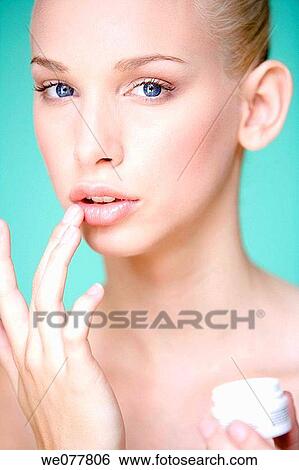 Stock Photograph - beauty, blue eyes, Beauty Care, apply. Fotosearch
