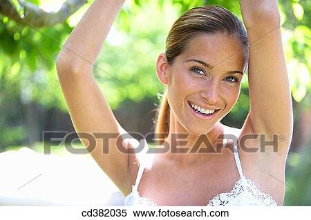 beauty, chestnut hair, brown hair, Arms raised View Large Photo Image Stock Photography - beauty, chestnut hair, brown hair, Arms raised. Fotosearch