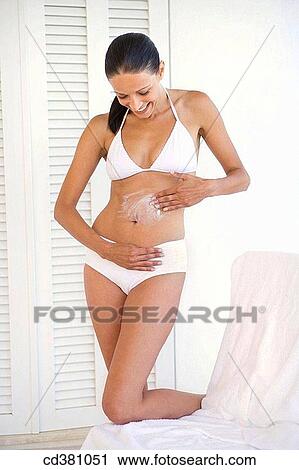 belly, brunette, Body care, apply View Large Photo Image Stock Image - belly, brunette, Body care, apply. Fotosearch