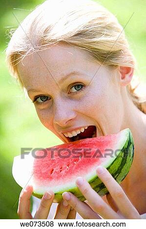 bite, biting, blond, Close-up View Large Photo Image Stock Photo - bite, biting, blond, Close-up. Fotosearch